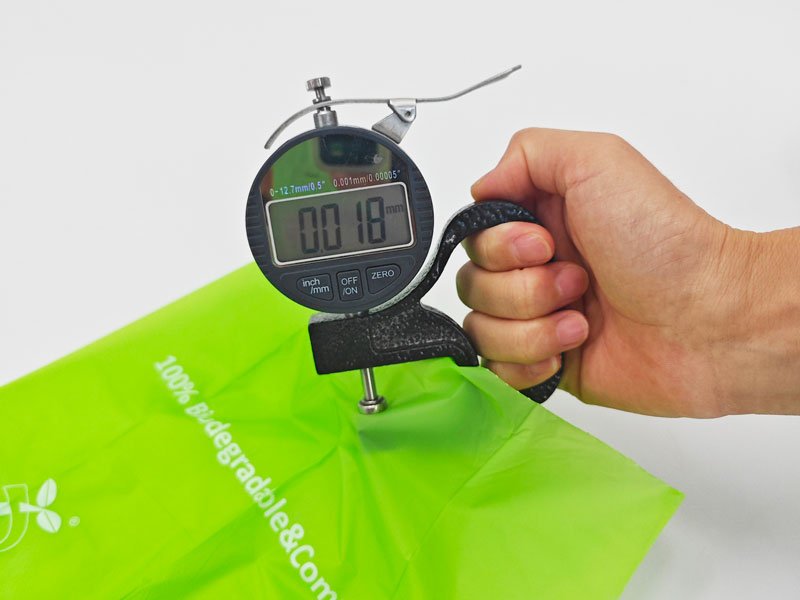 Thickness measurement of compostable dog poop bags during quality inspection